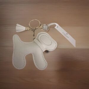 🆕 Dog-shaped White Vegan Leather Bag Charm with Gold Hardware and White Tassel